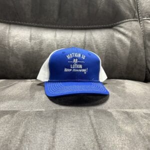 Blue trucker hat: Motion is Lotion.